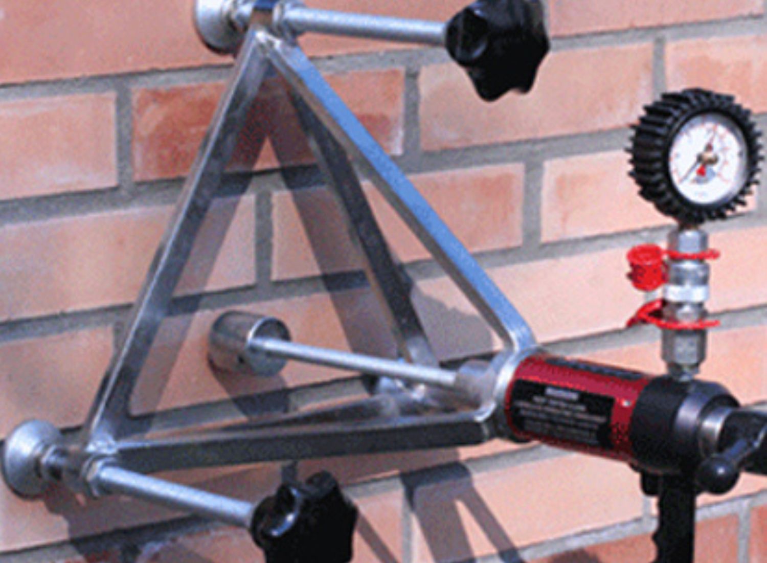 Anchor pull-out testing of fixings installed in concrete or masonry