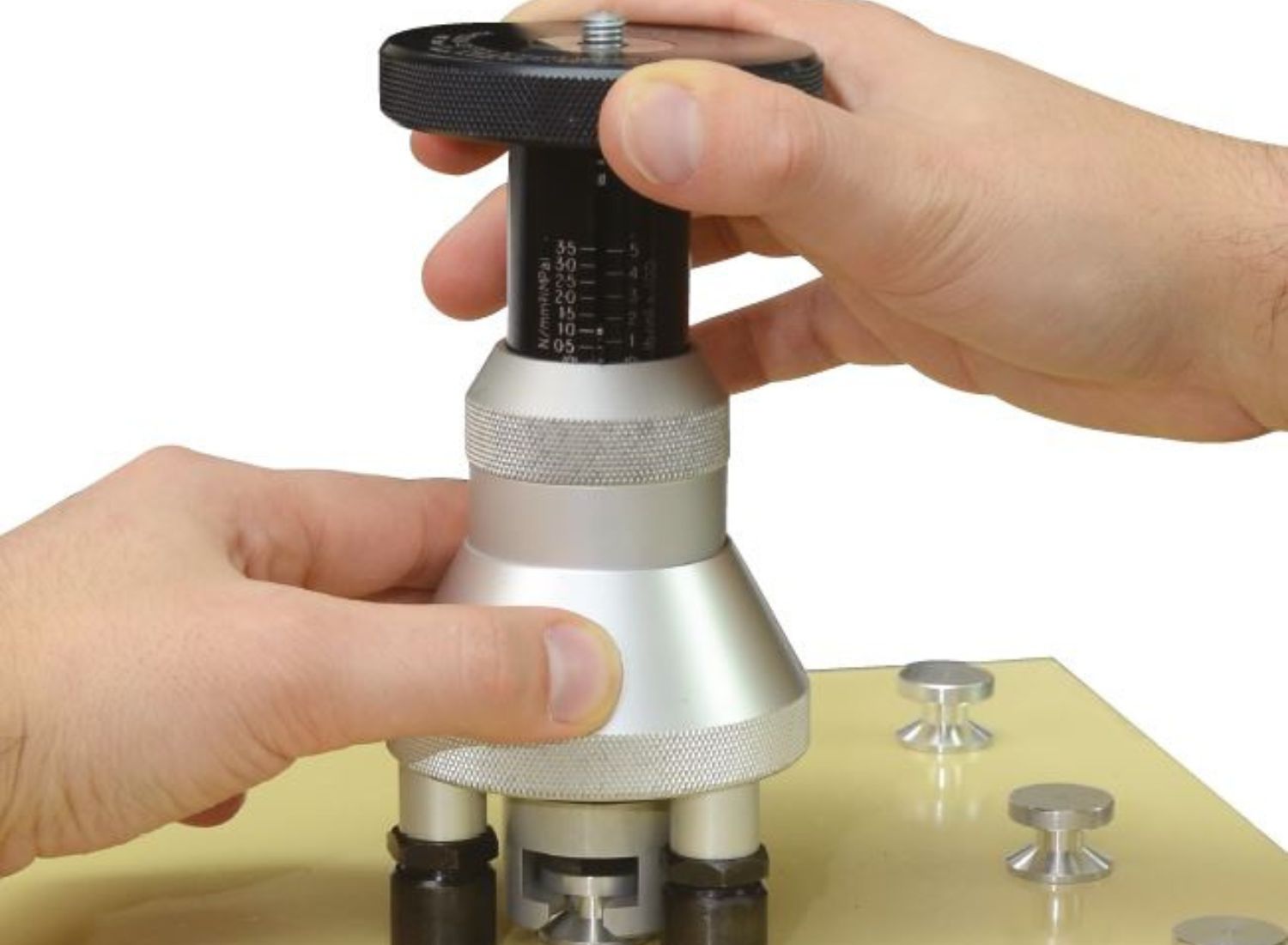 Pull-off adhesion test of surface coating to determine bond strength