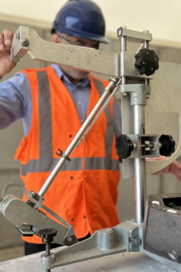 Materials testing laboratory with mechanical testing equipment and workstations