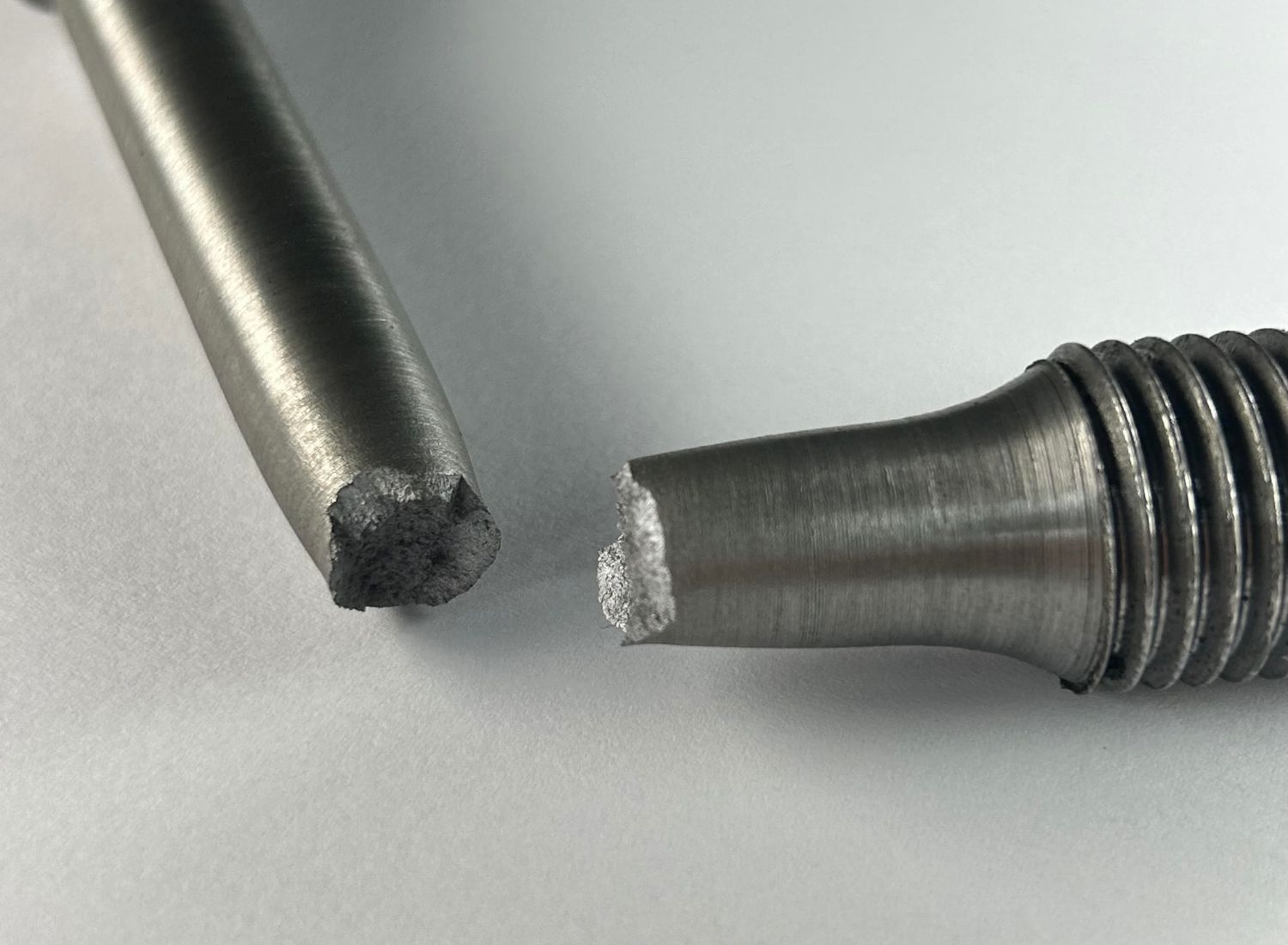 Tensile testing of metallic specimen to determine mechanical strength